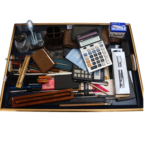 822 - A collection of various pens, Vintage calculators, stamp desk tidy, a Toledo letter opener etc