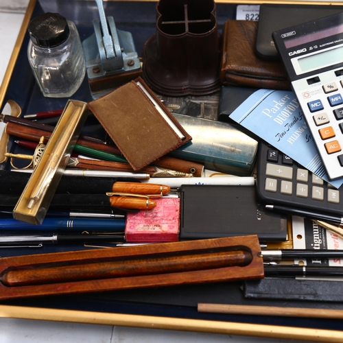 822 - A collection of various pens, Vintage calculators, stamp desk tidy, a Toledo letter opener etc