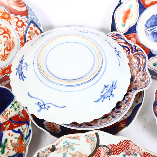 828 - A group of 8 Chinese Imari style plates, and a Chinese fan design dish of lobed form