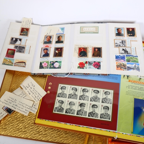 85 - An album of Chinese First Day Covers in presentation box, and an album of Chinese postage stamps