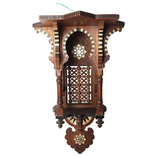 96 - A Moorish design carved and pierced wood hanging shrine, mother-of-pearl bone and ebony inlaid, L47c... 