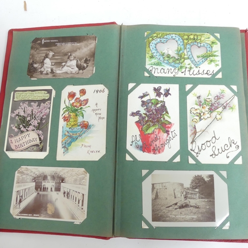 319 - A Victorian scrap album, and 2 other albums containing various Victorian postcards and greetings car... 