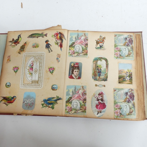 319 - A Victorian scrap album, and 2 other albums containing various Victorian postcards and greetings car... 