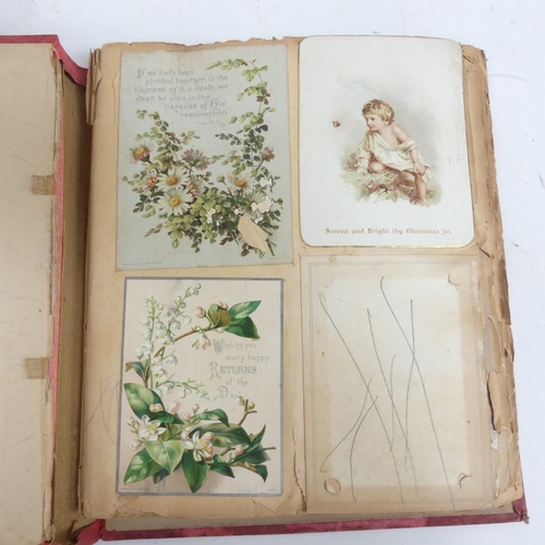 319 - A Victorian scrap album, and 2 other albums containing various Victorian postcards and greetings car... 