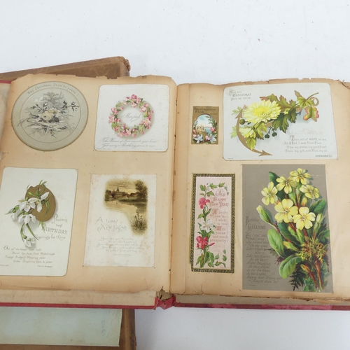 319 - A Victorian scrap album, and 2 other albums containing various Victorian postcards and greetings car... 