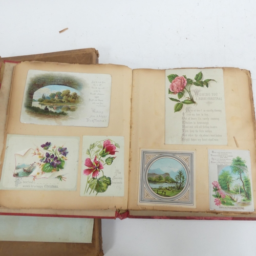 319 - A Victorian scrap album, and 2 other albums containing various Victorian postcards and greetings car... 