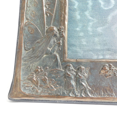 137 - An Art Nouveau embossed copper-mounted photo frame, and a 1920s oak photo frame with applied decorat... 