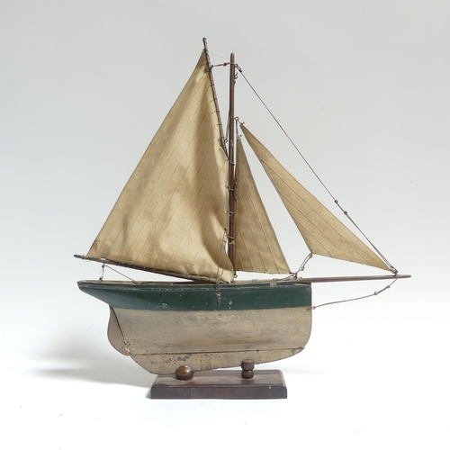 182 - An early 20th century scratch-built pond yacht, with lead applied to the keel, boat length 60cm, and... 