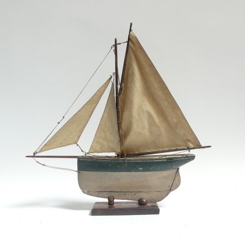 182 - An early 20th century scratch-built pond yacht, with lead applied to the keel, boat length 60cm, and... 