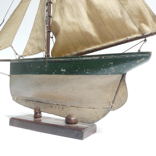 182 - An early 20th century scratch-built pond yacht, with lead applied to the keel, boat length 60cm, and... 