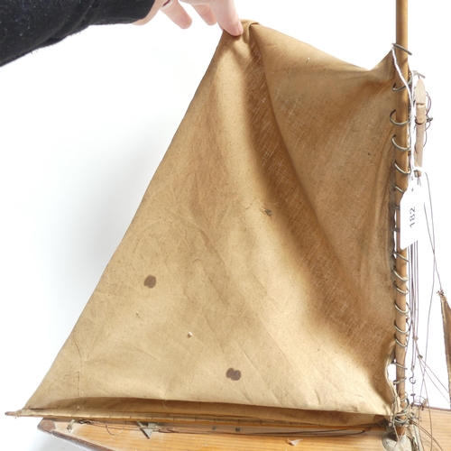 182 - An early 20th century scratch-built pond yacht, with lead applied to the keel, boat length 60cm, and... 