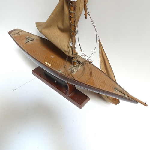 182 - An early 20th century scratch-built pond yacht, with lead applied to the keel, boat length 60cm, and... 