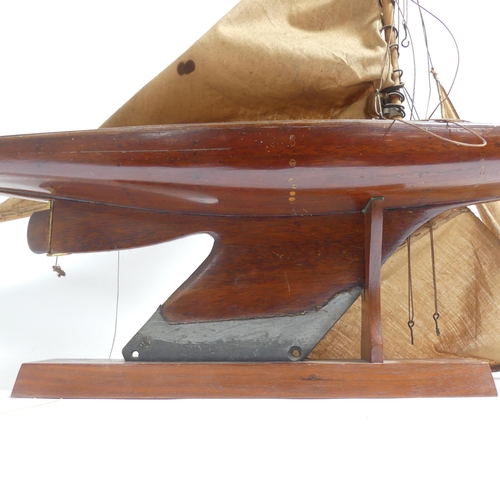 182 - An early 20th century scratch-built pond yacht, with lead applied to the keel, boat length 60cm, and... 