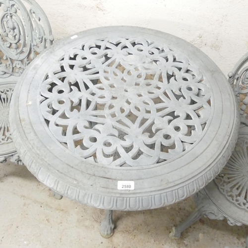 2580 - A cast iron continental style painted two-tier garden table, 70x73cm, with four matching chairs.