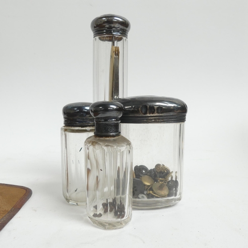 781 - A leather-cased gent's travelling set, including cut-throat razors, glass jars with silver tops, bru... 