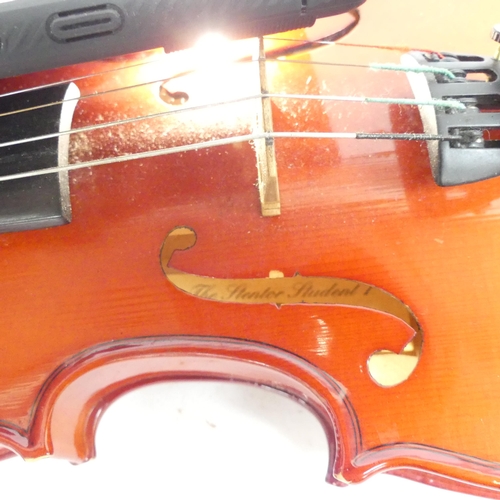 256 - A half-size violin, with label reading 