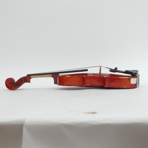 256 - A half-size violin, with label reading 