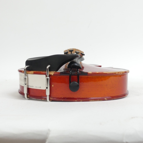 256 - A half-size violin, with label reading 