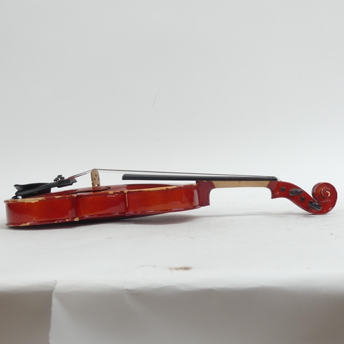 256 - A half-size violin, with label reading 