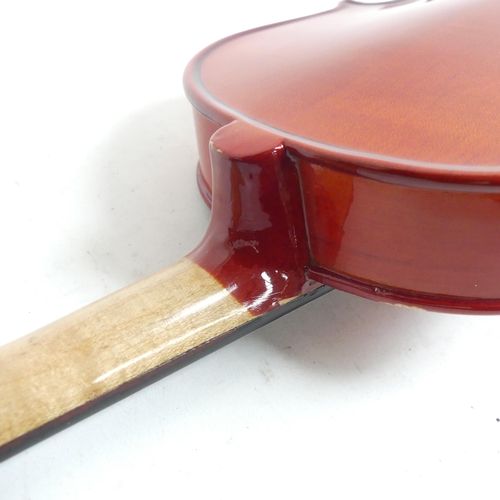 256 - A half-size violin, with label reading 