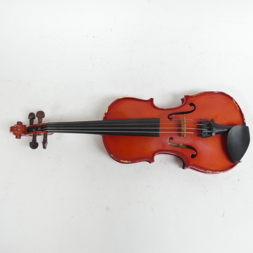 256 - A half-size violin, with label reading 