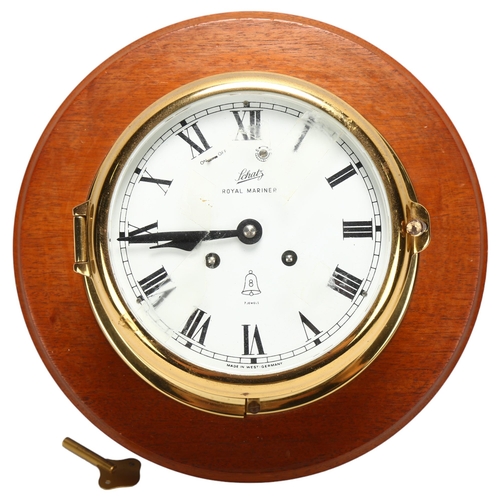 108 - A brass-cased ship's dial wall clock, Schatz Royal Mariner, 8-day striking movement, mounted on maho... 