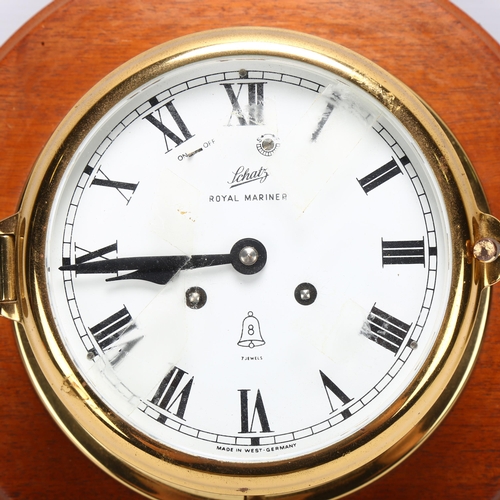 108 - A brass-cased ship's dial wall clock, Schatz Royal Mariner, 8-day striking movement, mounted on maho... 