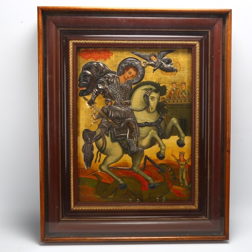 110 - A Greek 18th century icon depicting St George and the Dragon, hand painted and gilded panel with app... 