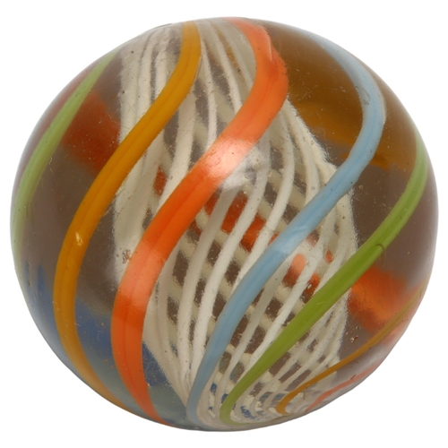 113 - A large Victorian glass marble, with coloured swirl and latachino twist interior, diameter approx 4c... 