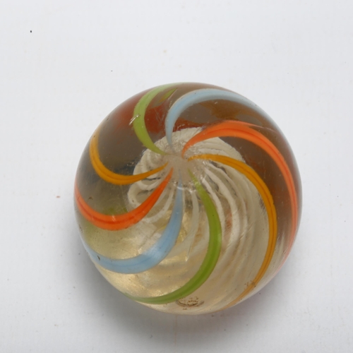 113 - A large Victorian glass marble, with coloured swirl and latachino twist interior, diameter approx 4c... 