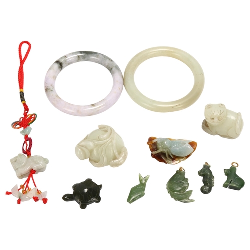 116 - A group of Chinese jade and hardstone carvings, bangles and pendants