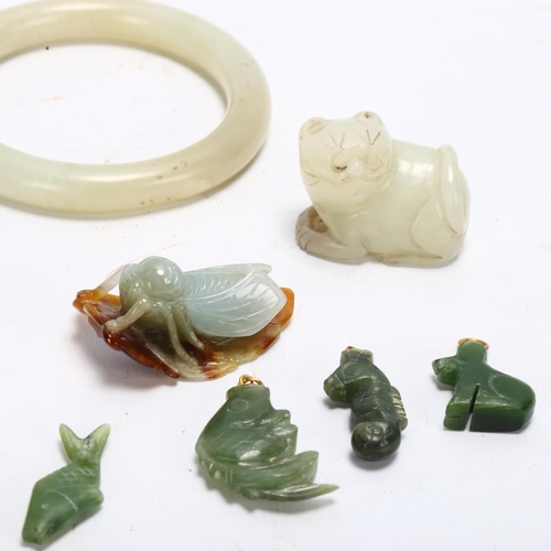 116 - A group of Chinese jade and hardstone carvings, bangles and pendants