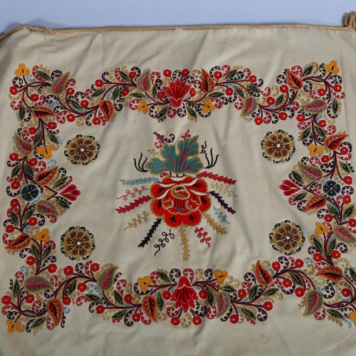 118 - 2 early 20th century crewel embroidered panels, 58cm across, 1 with a rope border, the other mounted... 