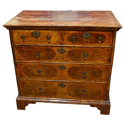 12 - A William and Mary Period walnut chest of drawers, crossbanded top above 2 short and 3 long drawers ... 