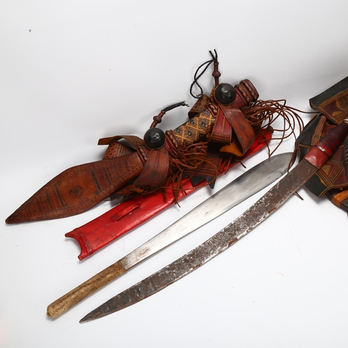 121 - Mandinka decorated leather sword and hat, and a Masai sword with red leather scabbard