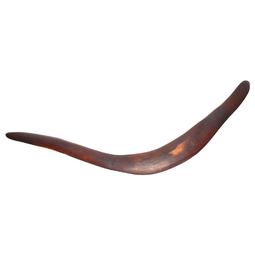 126 - A large Australian Aboriginal hardwood boomerang, with faint engraved geometric designs, length 87cm