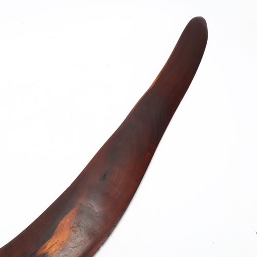 126 - A large Australian Aboriginal hardwood boomerang, with faint engraved geometric designs, length 87cm