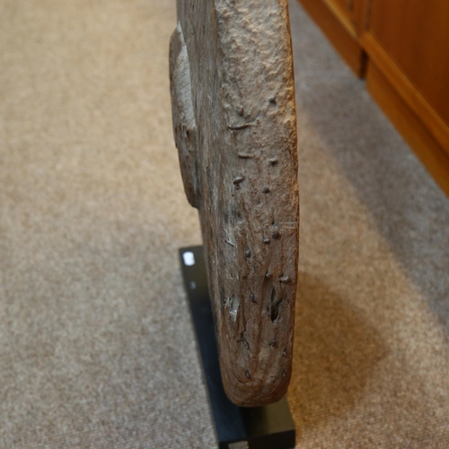 129 - An Ancient wooden cartwheel on modern stand, overall height 72cm