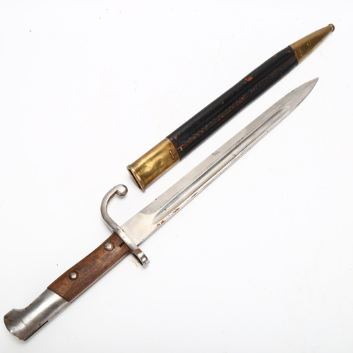 147 - Early 20th century bayonet with brass and leather scabbard