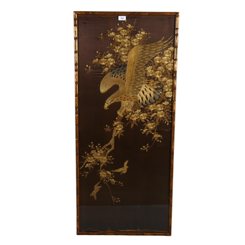 182 - A Chinese silk embroidered picture, depicting an eagle and small birds in a tree, brown silk ground,... 