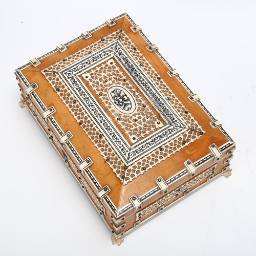 19 - A 19th century Anglo-Indian wooden Jewellery box, with bone pierced and mounted decoration, claw fee... 