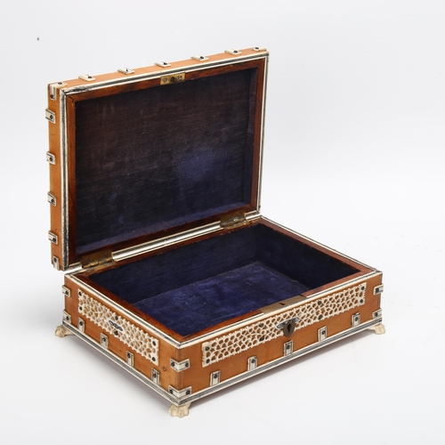 19 - A 19th century Anglo-Indian wooden Jewellery box, with bone pierced and mounted decoration, claw fee... 