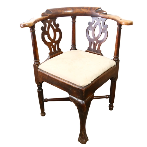 197 - An 18th century ash corner armchair with drop-in seat