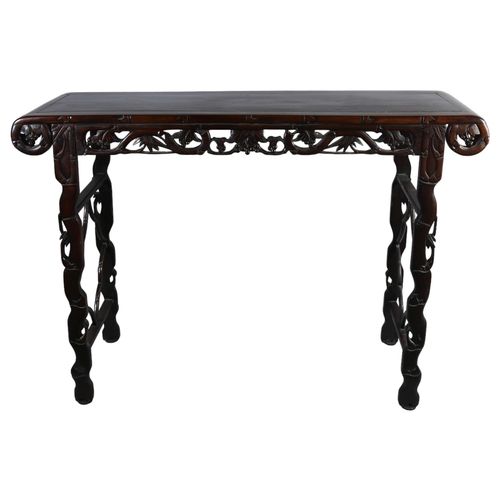 199 - A Chinese 19th century rosewood altar table, with grapevine carved and pierced frieze on carved supp... 