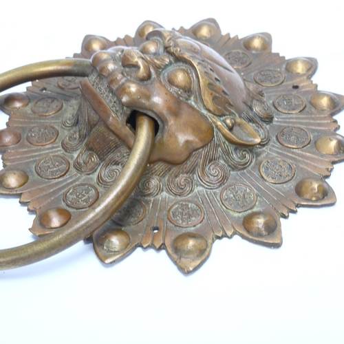 201 - A Chinese cast-brass dragon mask design door knocker, width 20cm