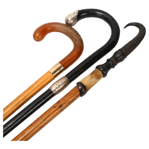 26 - 3 1920s' walking canes, 1 malacca and faux amber cane with 9ct hallmarked gold collar engraved to Co... 