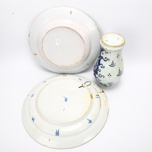 41 - 2 x 18th century Delft blue and white pottery chargers, largest 34cm diameter, and a Delft relief mo... 