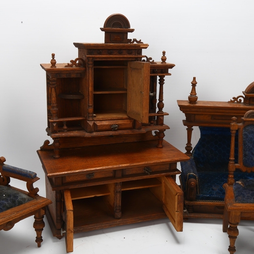 46 - A set of early 20th century oak dolls furniture, dresser, upholstered sofa and two chairs, dresser h... 