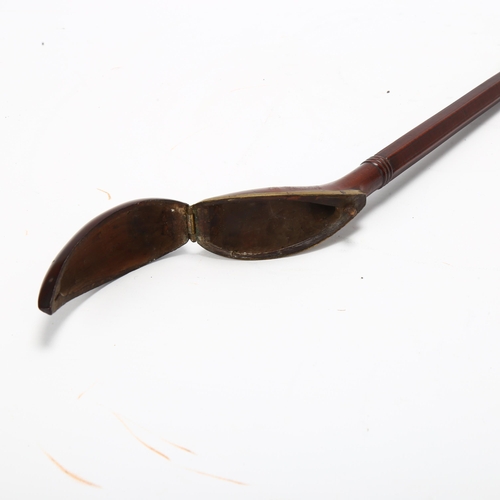 47 - An 18th/19th century Dutch rosewood and brass clay pipe holder, length 29cm