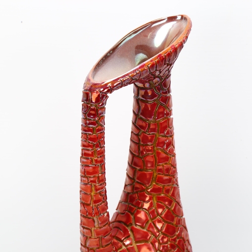 49 - Zsolnay Pecs, Hungary, a red lustre crackle glaze ewer, makers stamp to base, height 31cm